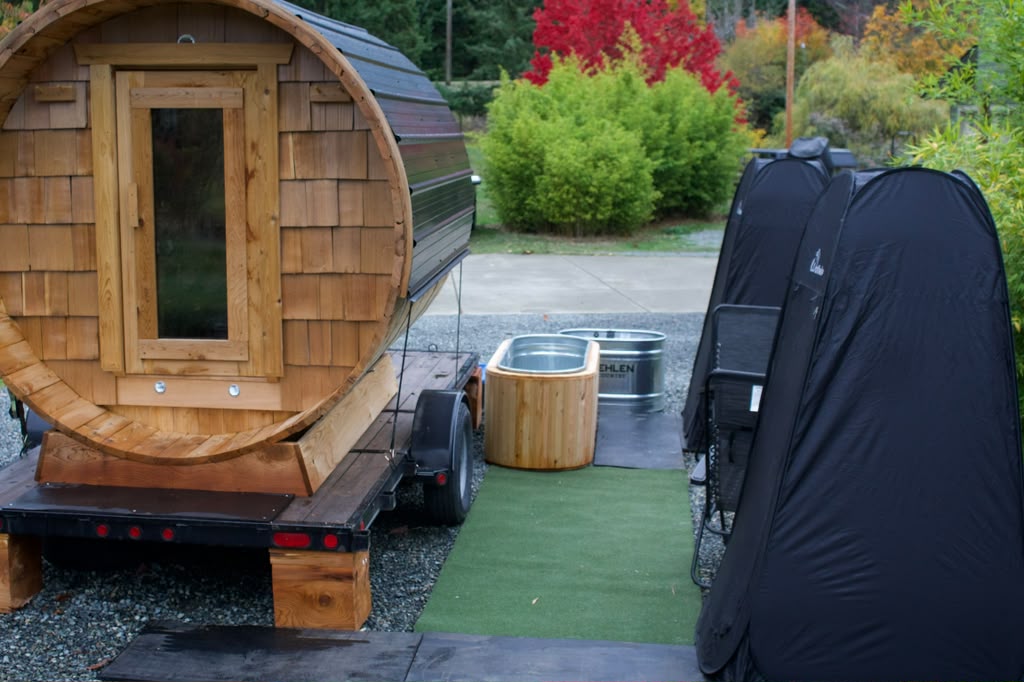 The mobile cedar sauna with plunge tubs alongside